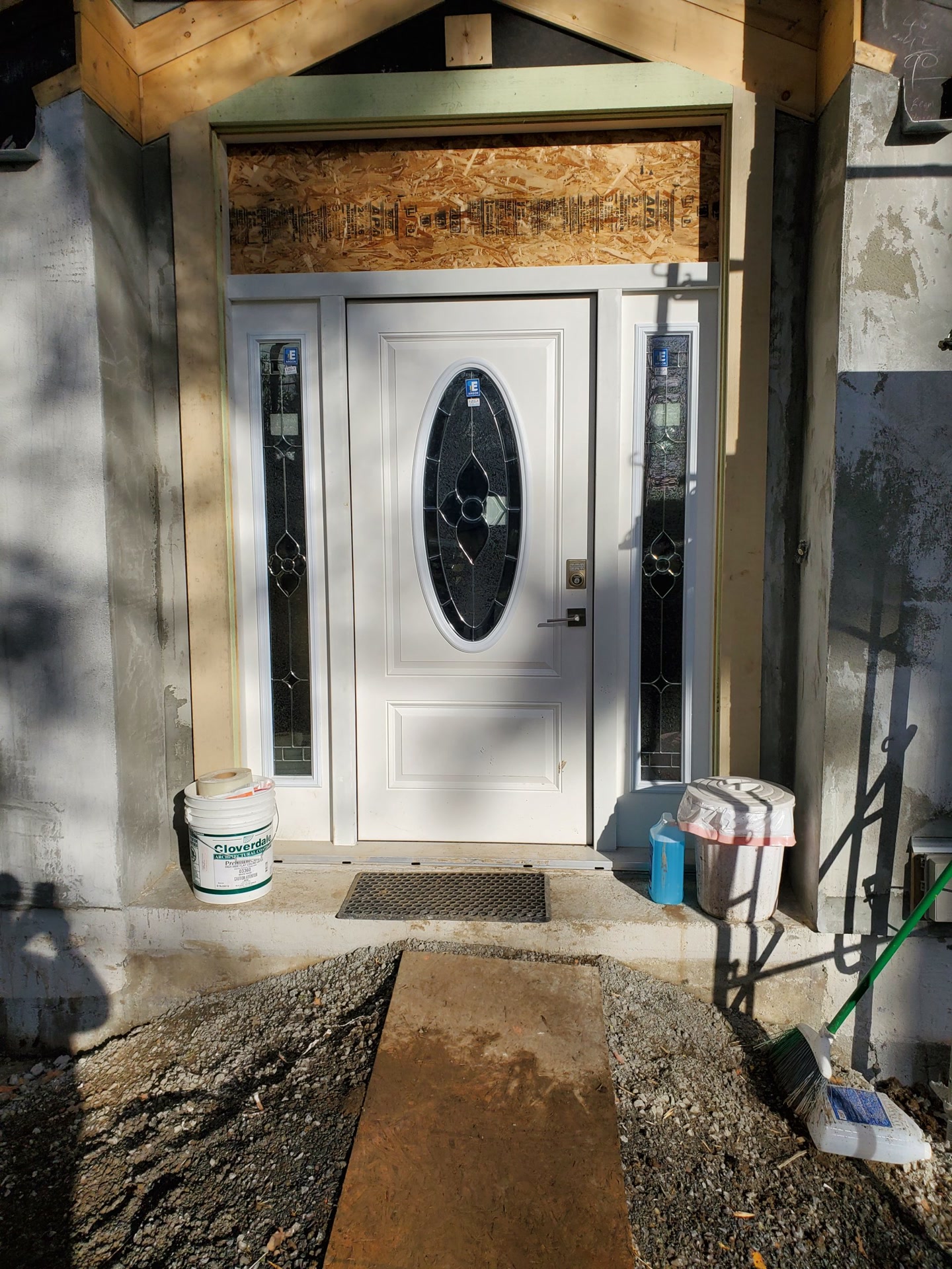 New front door with sidelights being installed